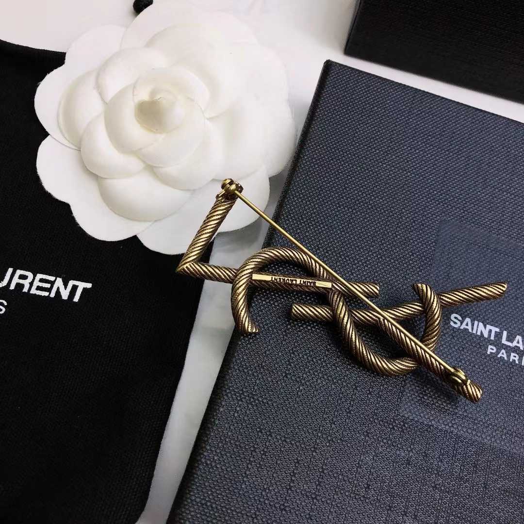 Saint Laurent Goldtone YSL Logo Brooch - EUR FASHION