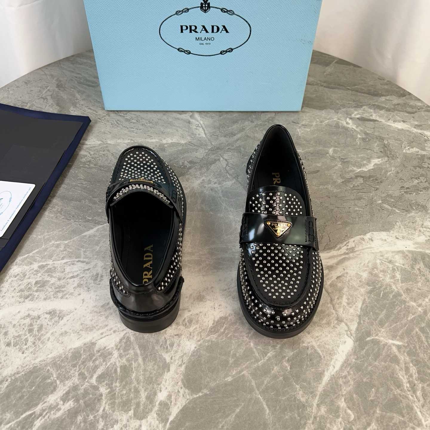 Prada Studded Brushed Leather Loafers - EUR FASHION