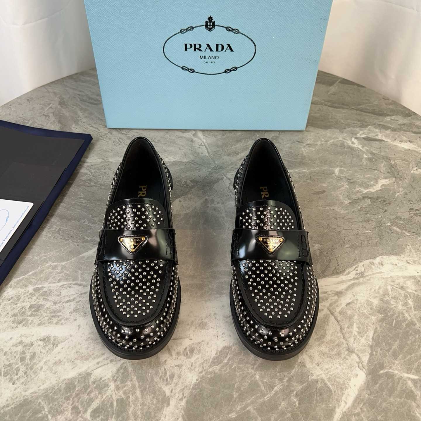 Prada Studded Brushed Leather Loafers - EUR FASHION