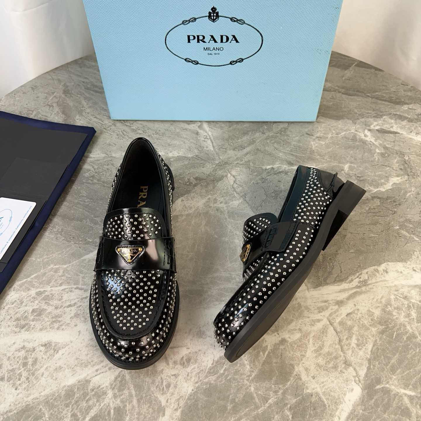 Prada Studded Brushed Leather Loafers - EUR FASHION