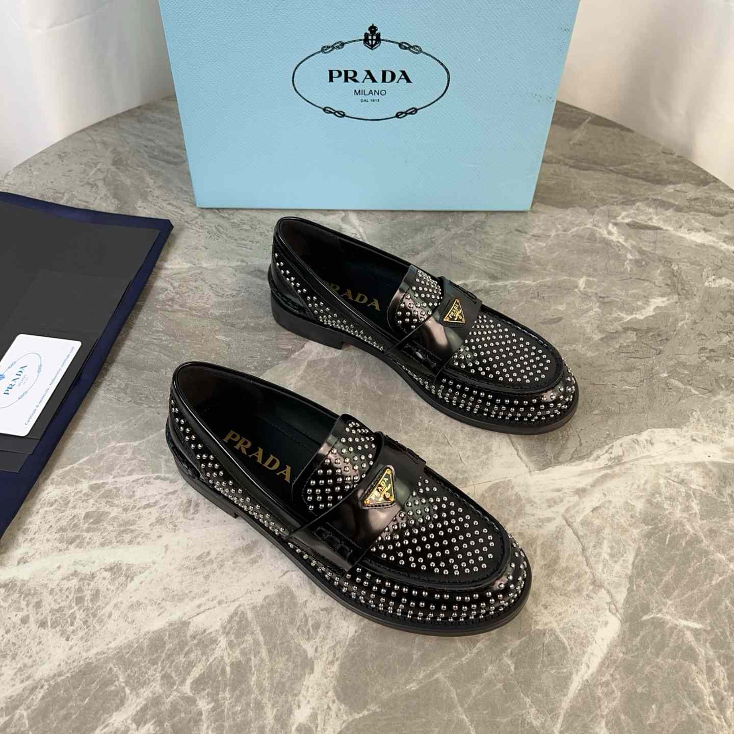 Prada Studded Brushed Leather Loafers - EUR FASHION