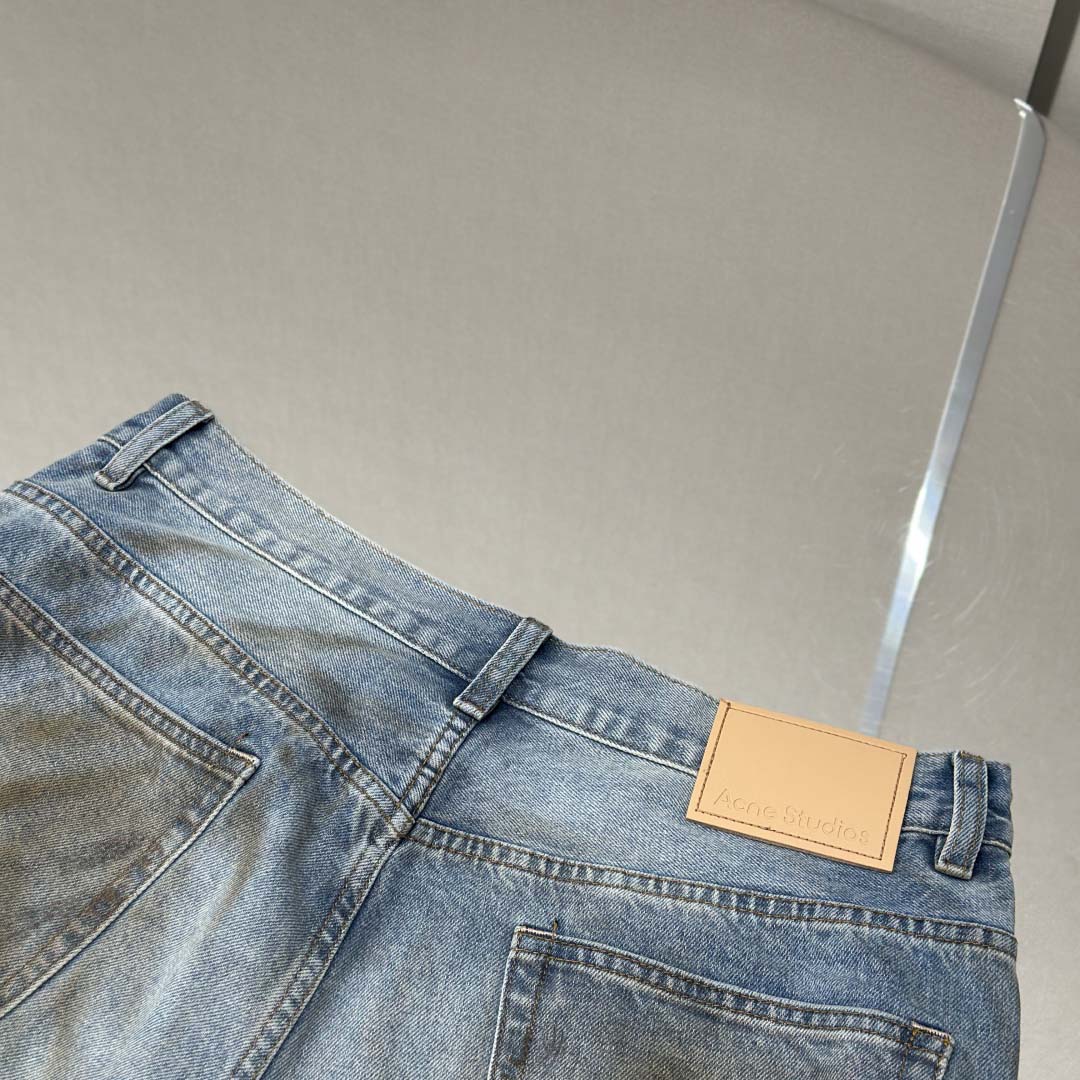 Acne Studios Mud-dyed torn jeans - EUR FASHION