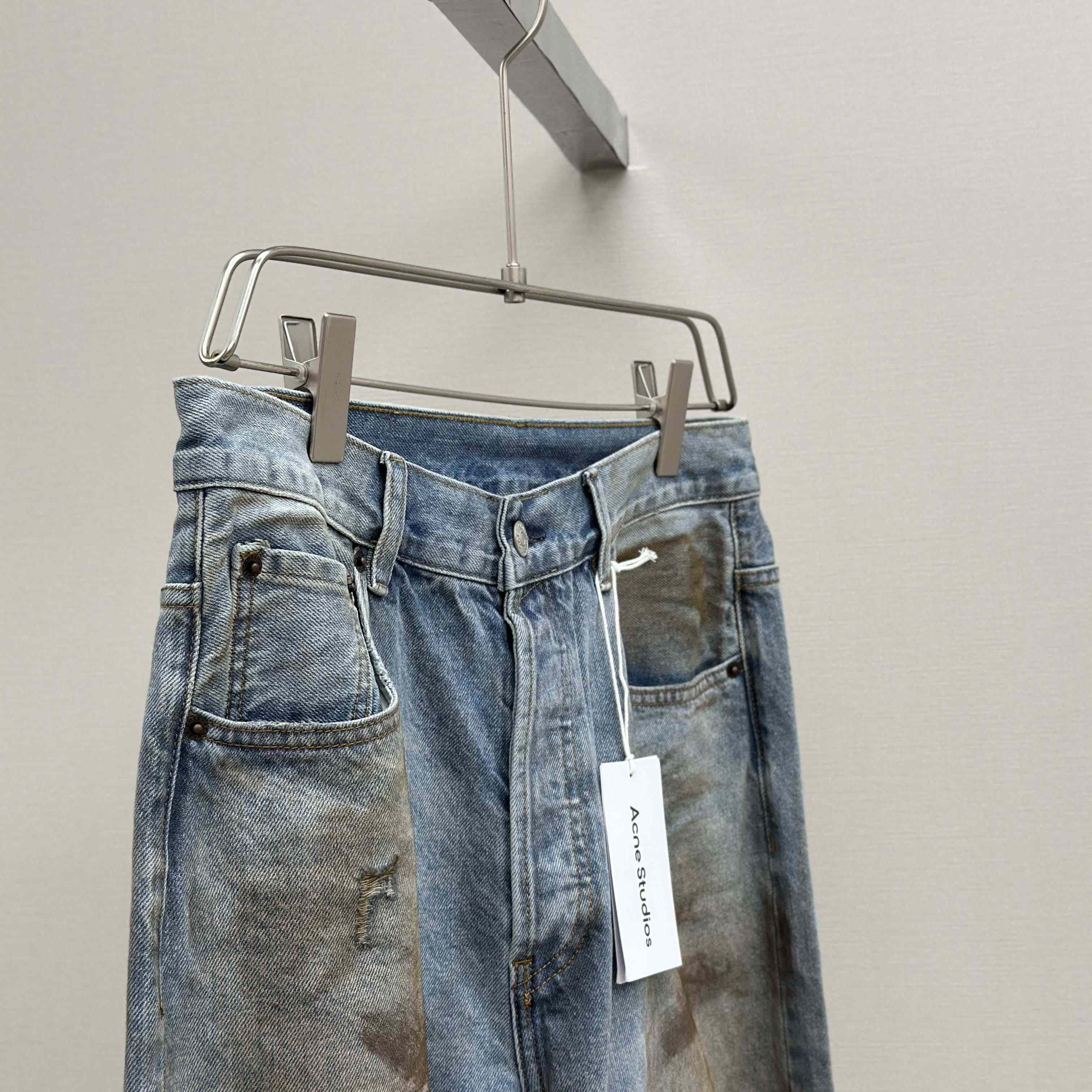 Acne Studios Mud-dyed torn jeans - EUR FASHION