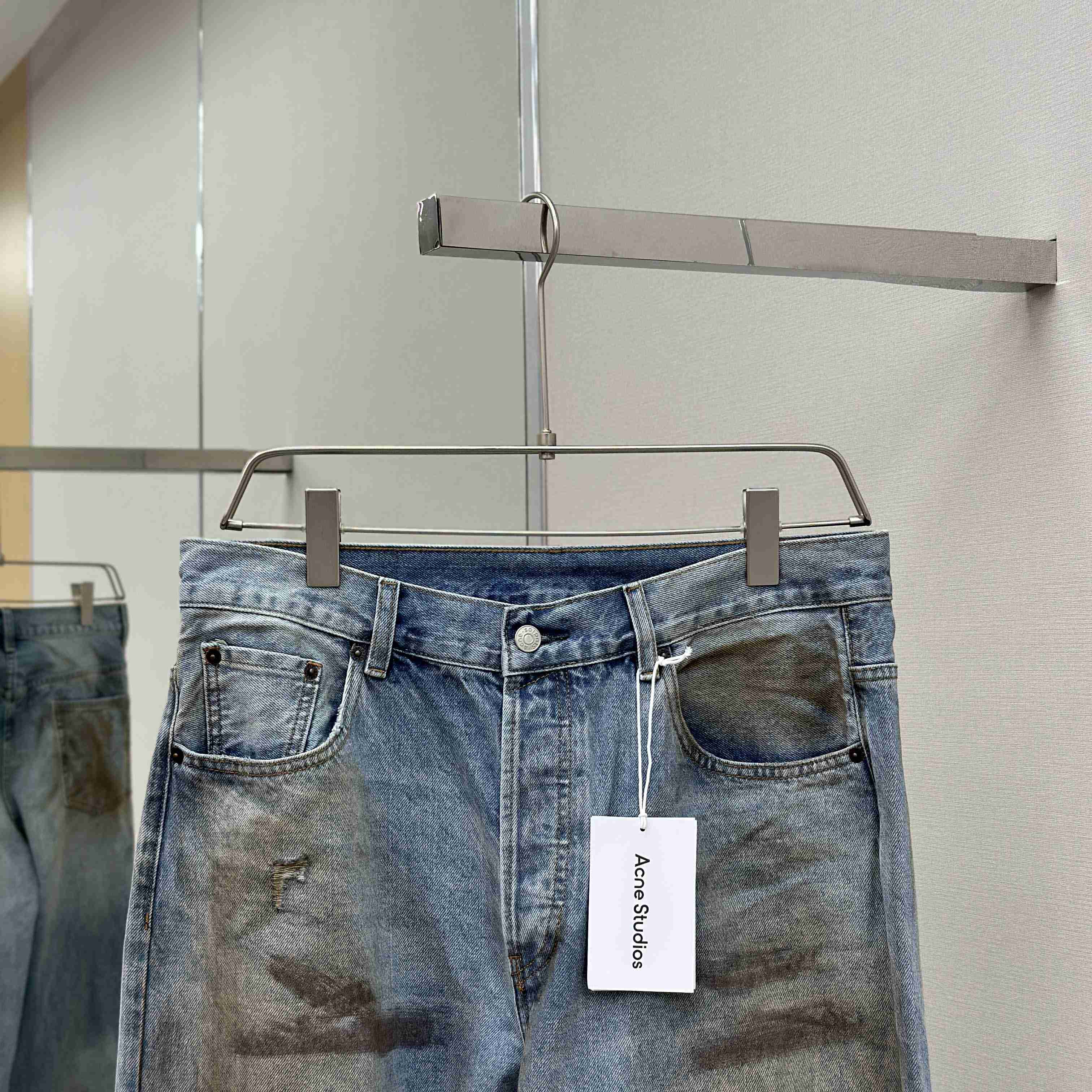 Acne Studios Mud-dyed torn jeans - EUR FASHION