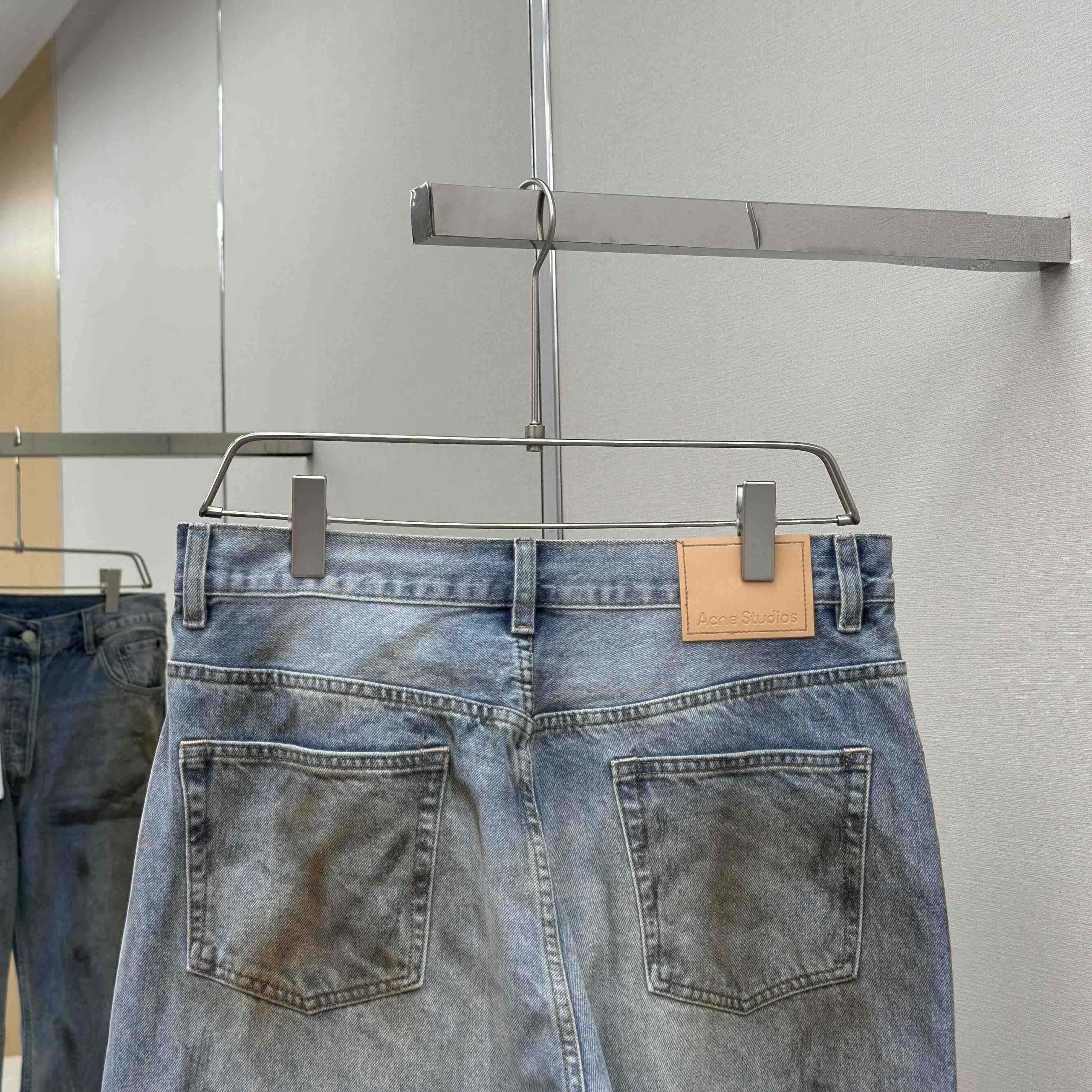 Acne Studios Mud-dyed torn jeans - EUR FASHION