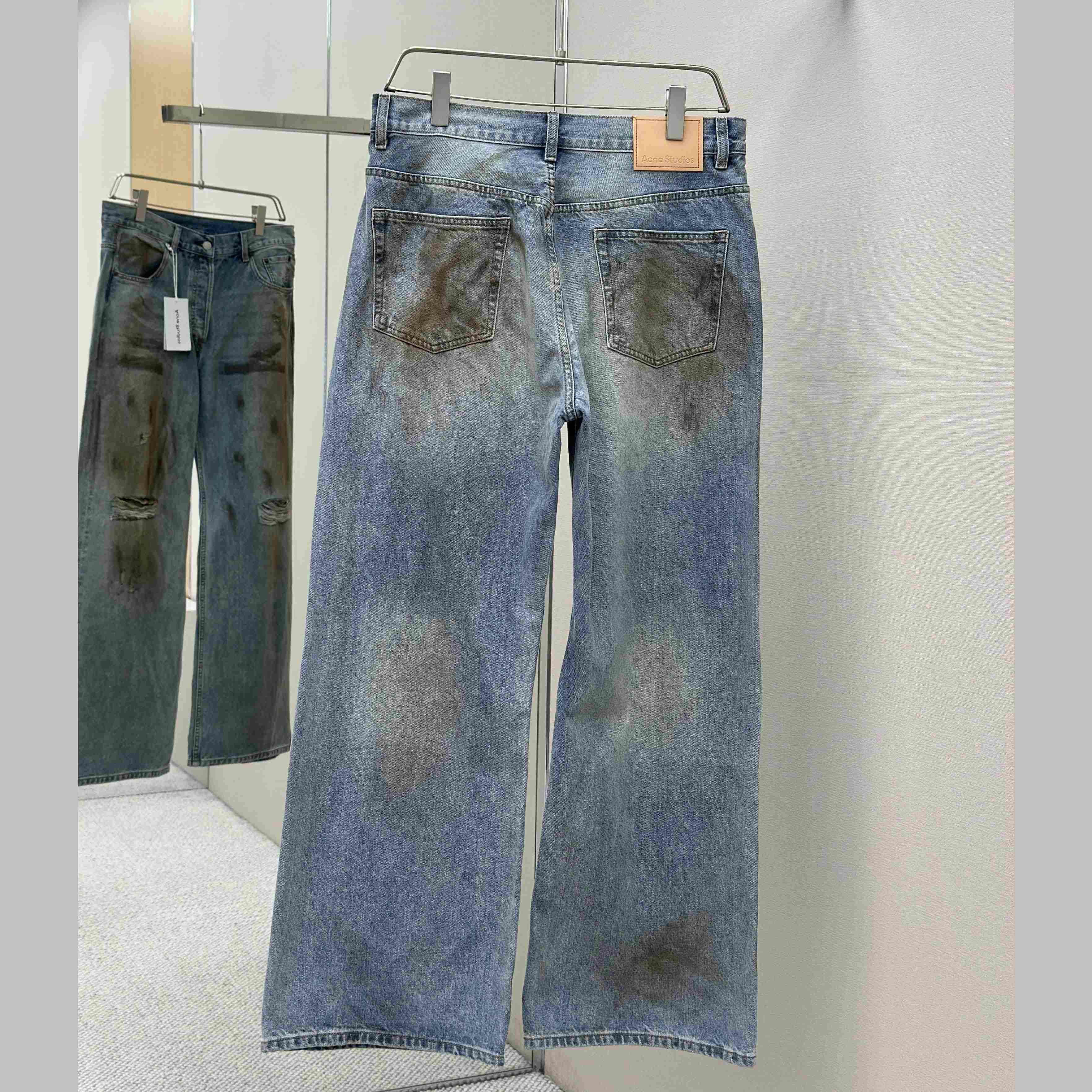 Acne Studios Mud-dyed torn jeans - EUR FASHION
