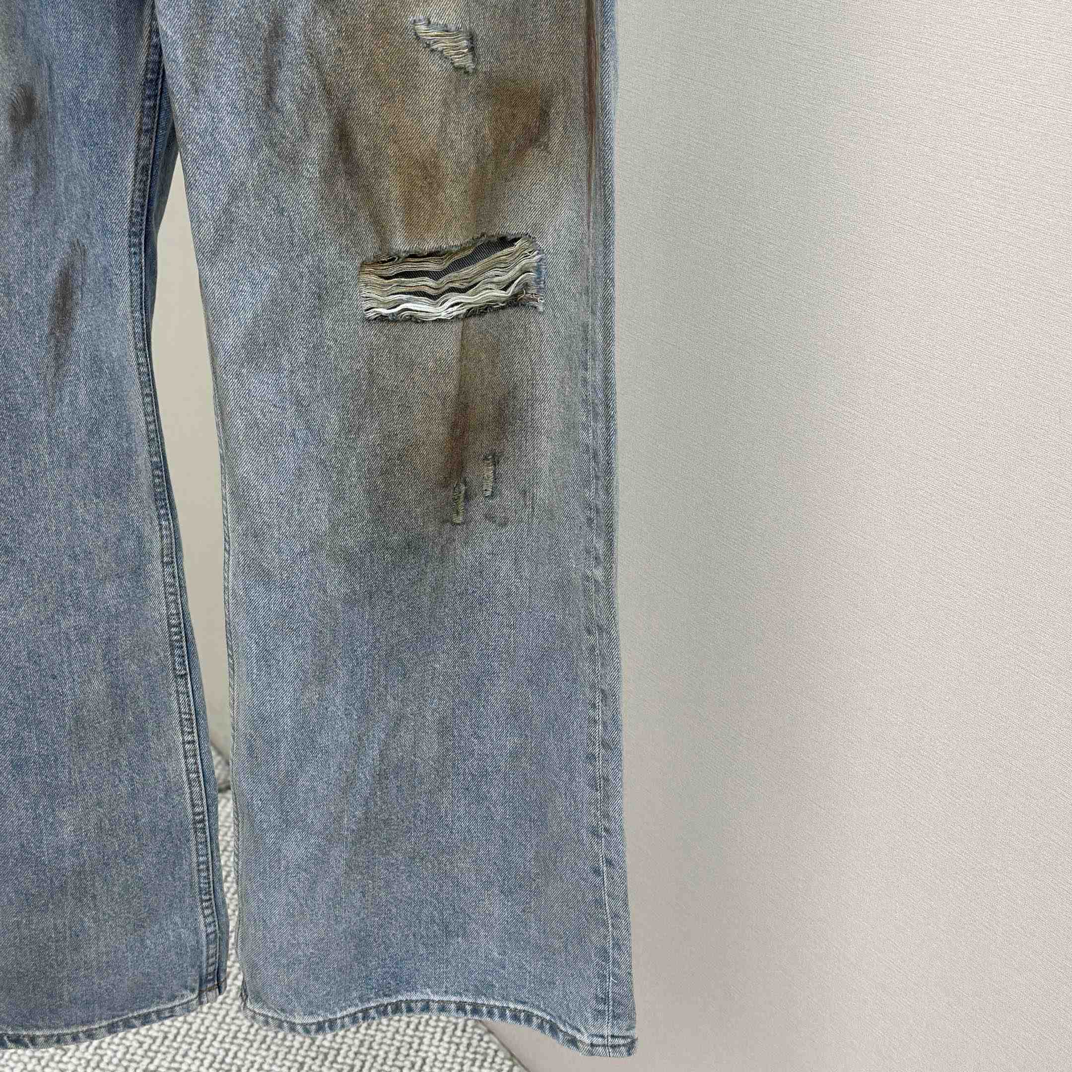 Acne Studios Mud-dyed torn jeans - EUR FASHION